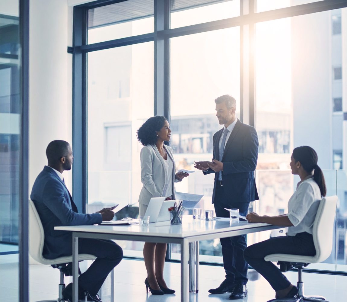 firefly a professional scene set in a modern boardroom or meeting room. a small team having a 523663